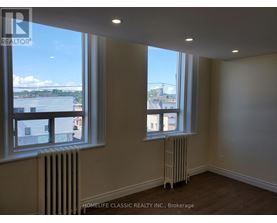 A room with a window and a radiator.