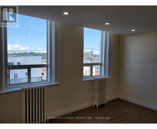 A room with a window and a radiator.