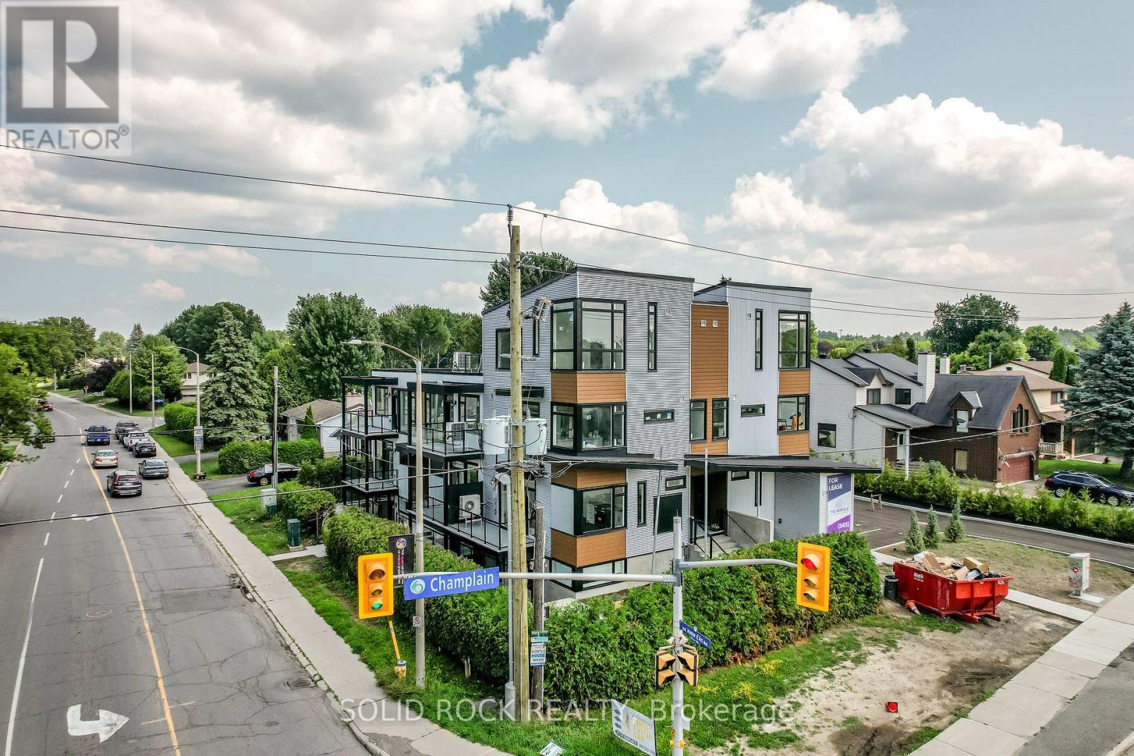 A modern apartment building is located on Champlain Street.