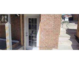A white door with a glass window is on the left and a white chair is on the right.
