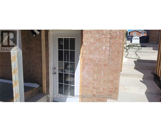 A white door with a glass window is on the left and a white chair is on the right.