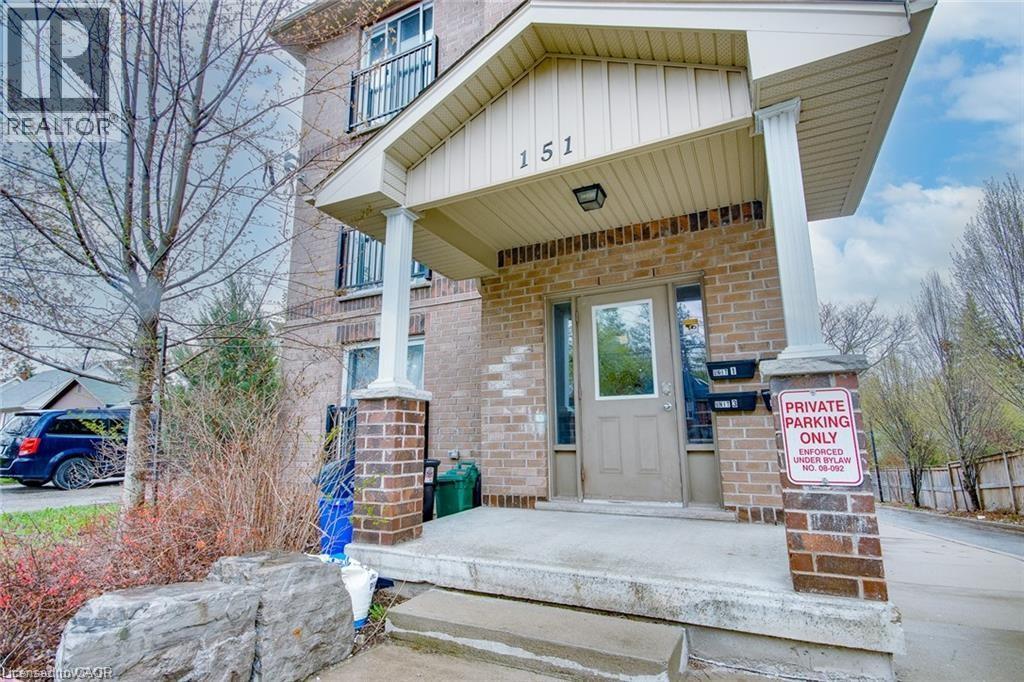 A house with a sign that says "PRIVATE PARKING ONLY" in front of it.