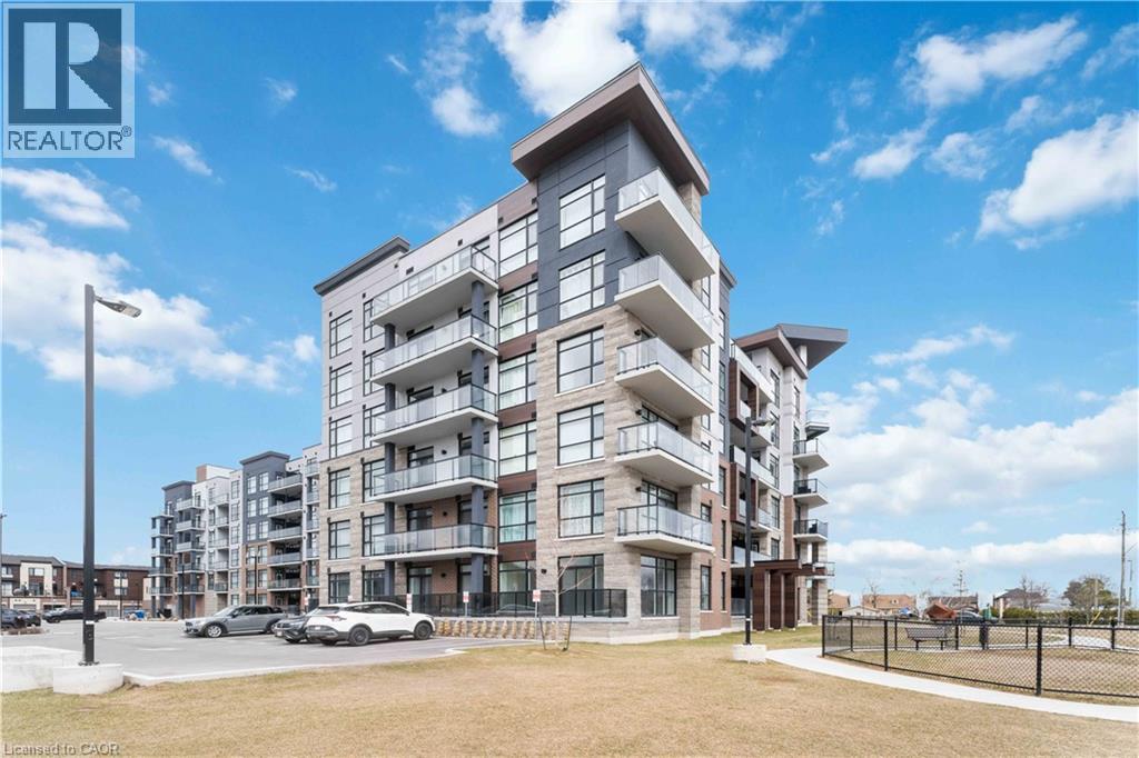A modern apartment building with a clear blue sky above.