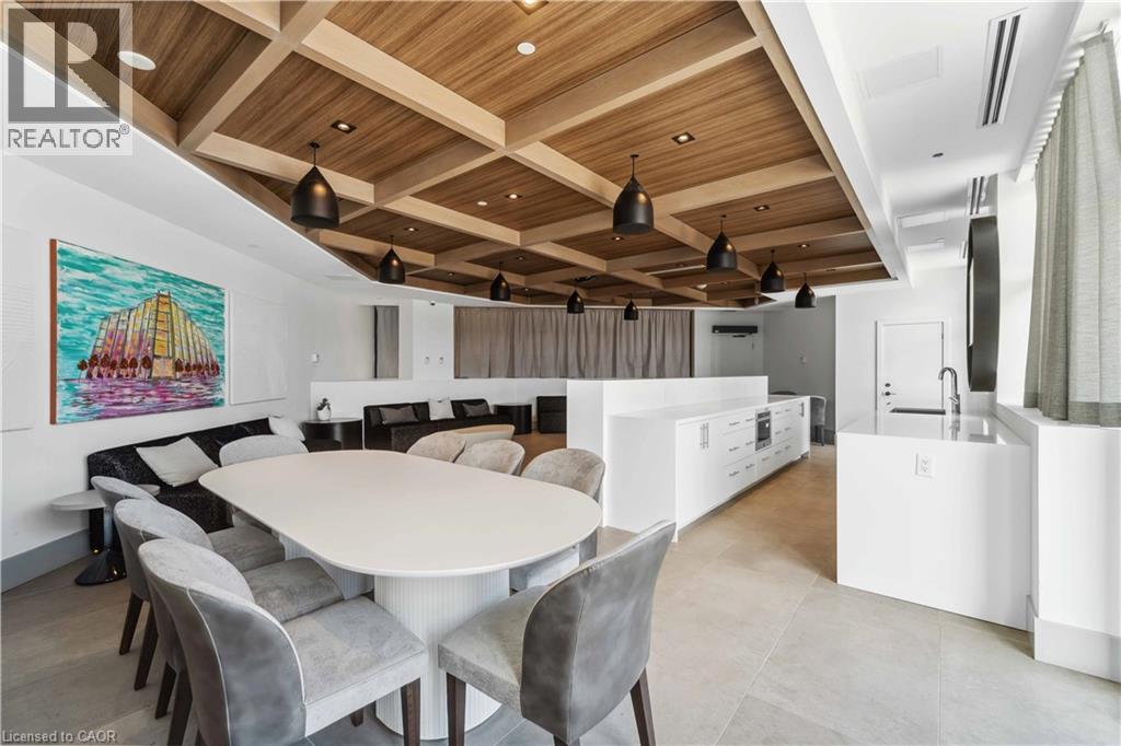 A modern dining room with a large table and chairs.