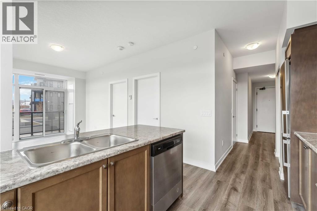 A kitchen with a sink and a dishwasher.