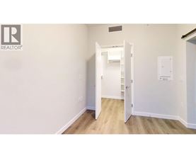 A white door is open to a hallway.