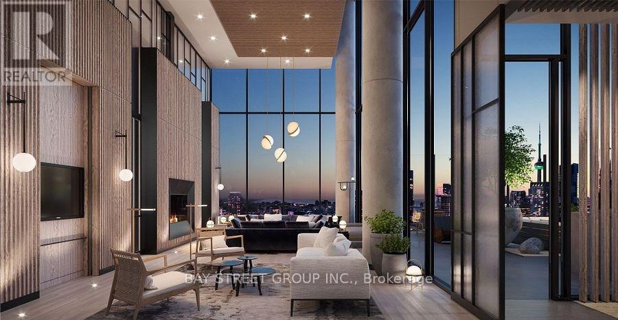 A modern living room with a view of the city at dusk.