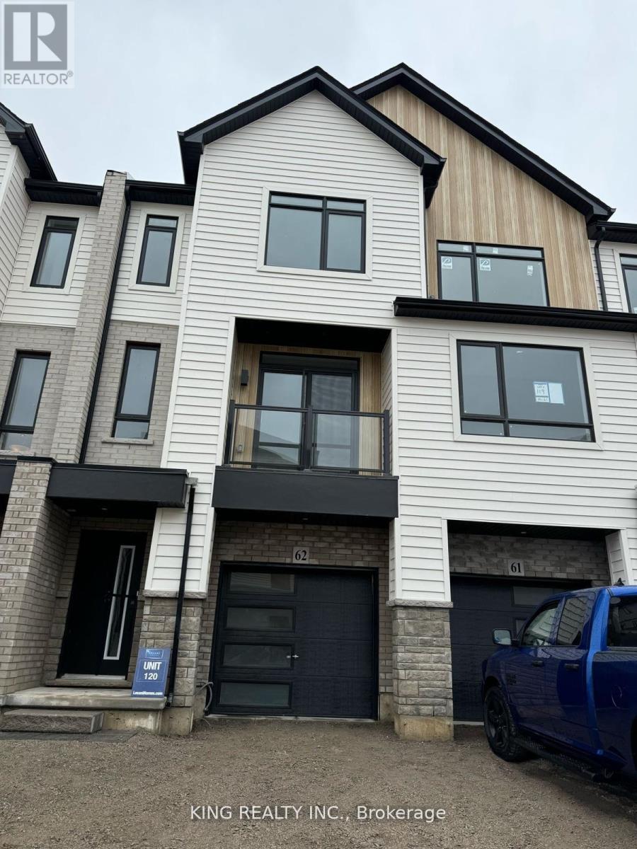 A modern two-story building with a blue pickup truck parked in front.