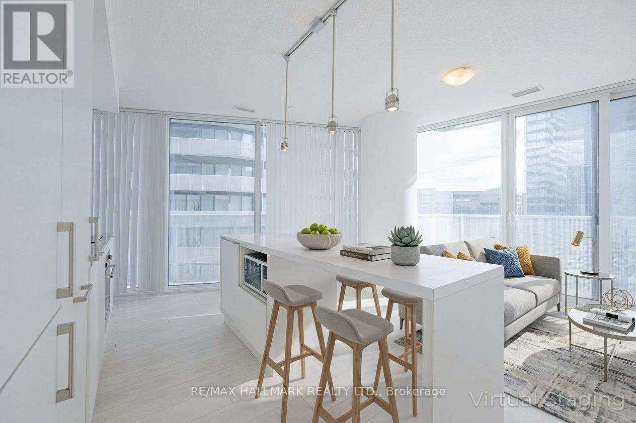 A modern kitchen with a bar stool and a countertop.