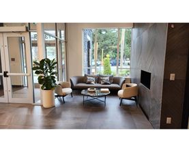 A living room with a couch, chairs, and a coffee table.
