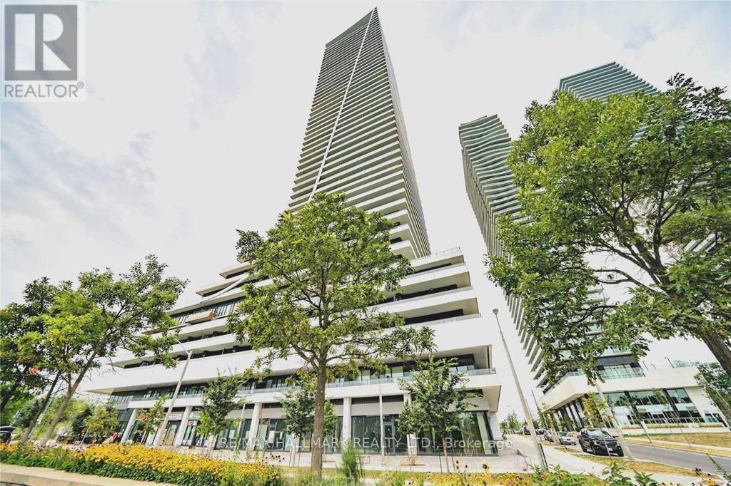 A modern building with a triangular skyscraper in the middle.