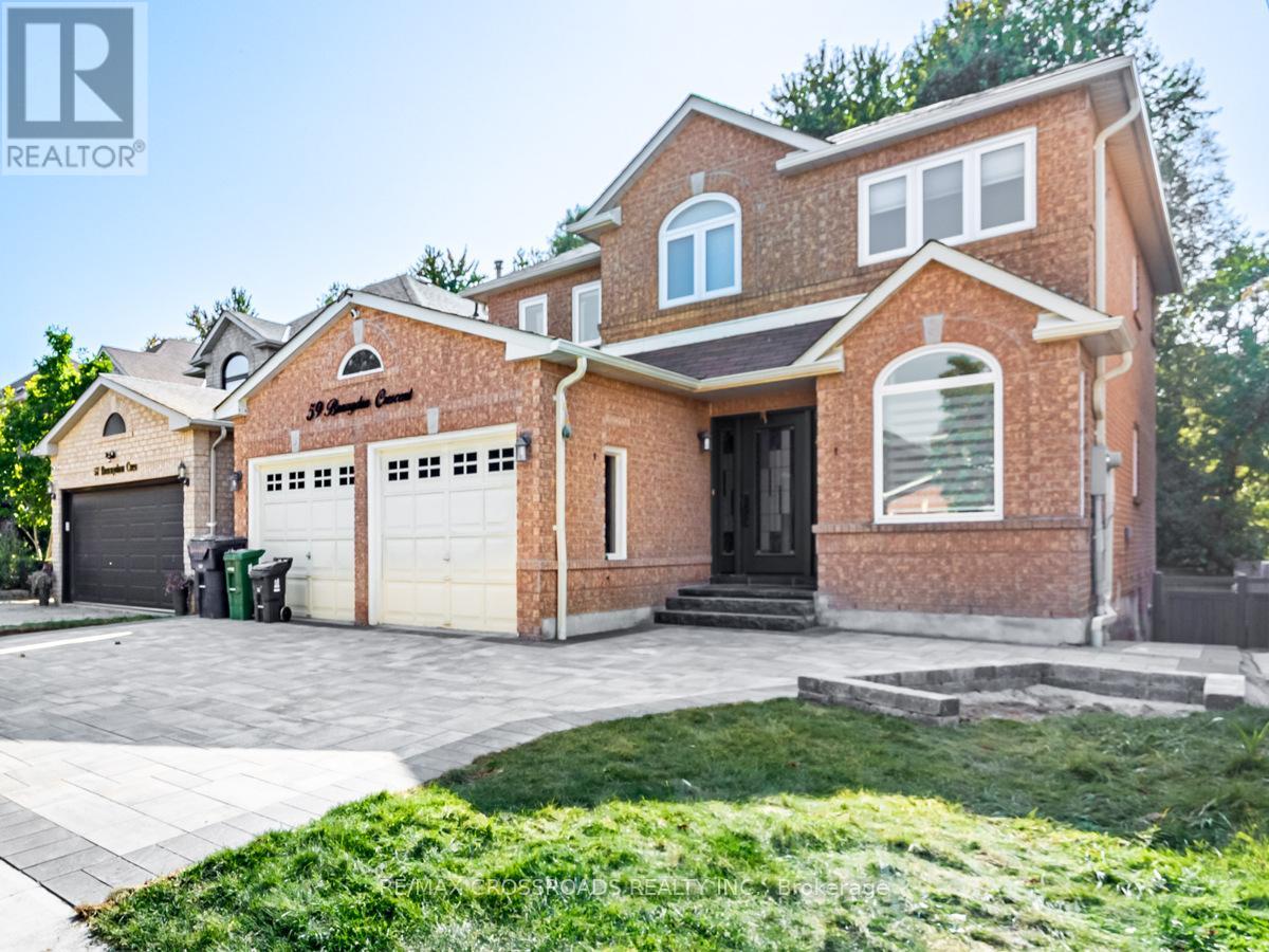 A house with a brown brick exterior and a large front yard.
