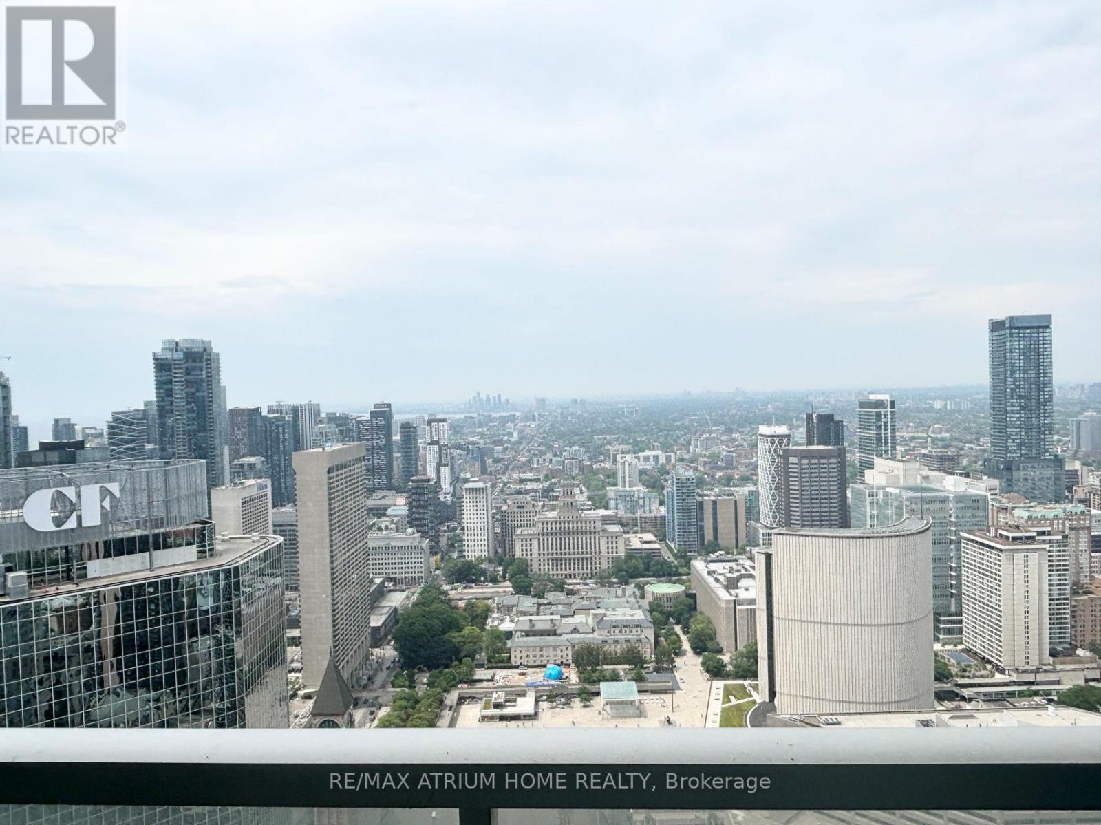 A cityscape with a building that has the letters "CF" on it.