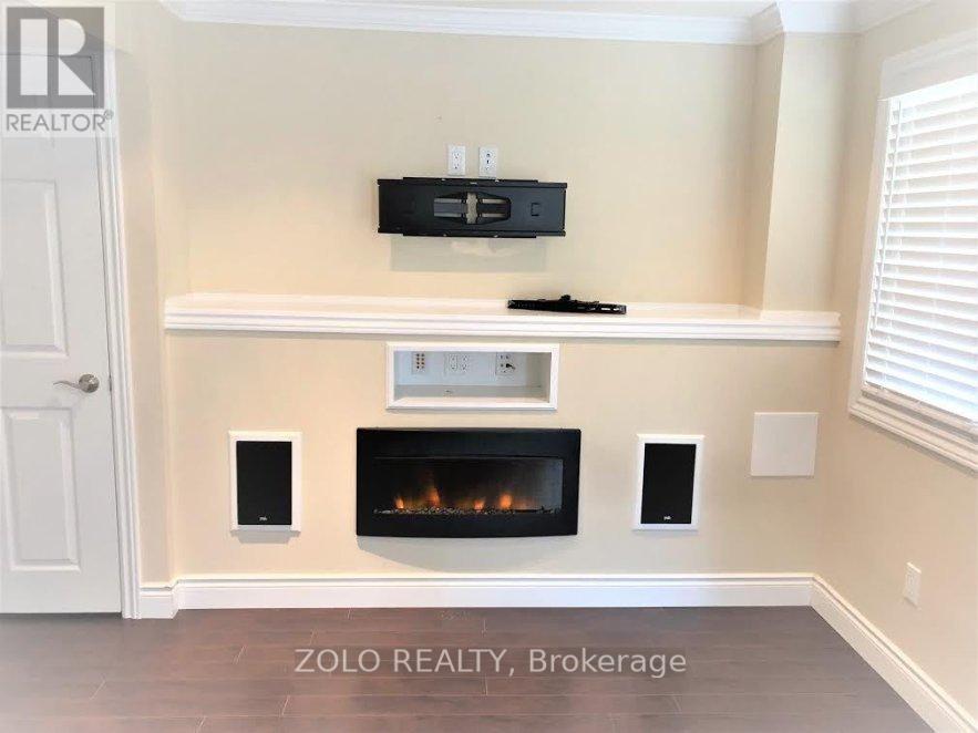 A modern living room with a fireplace and built-in TV.