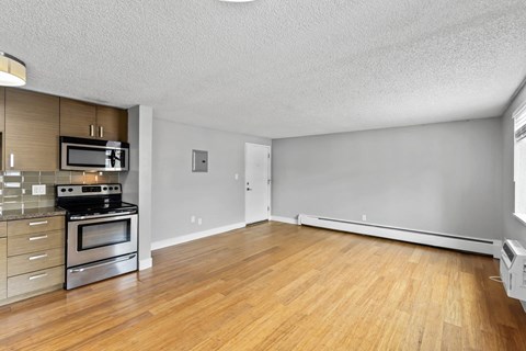 A kitchen with a stove top oven and microwave.