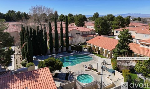 A large house with a pool in the backyard.