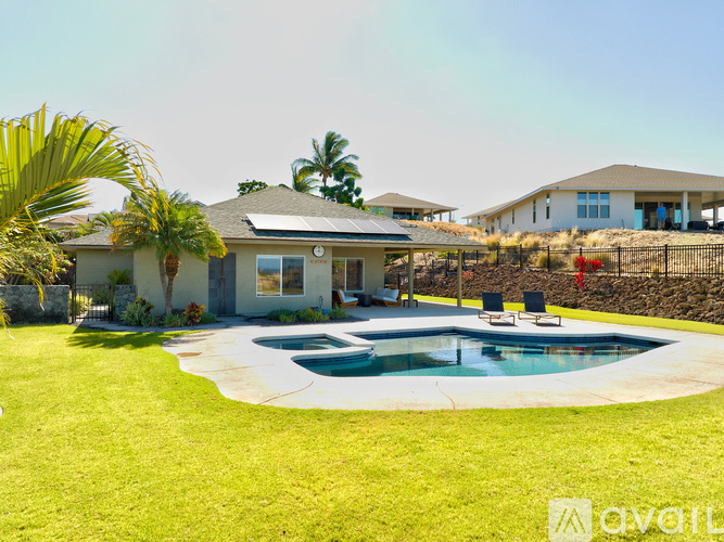 A house with a pool in the backyard.