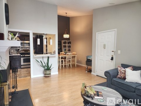 A living room with a grey couch and a coffee table.