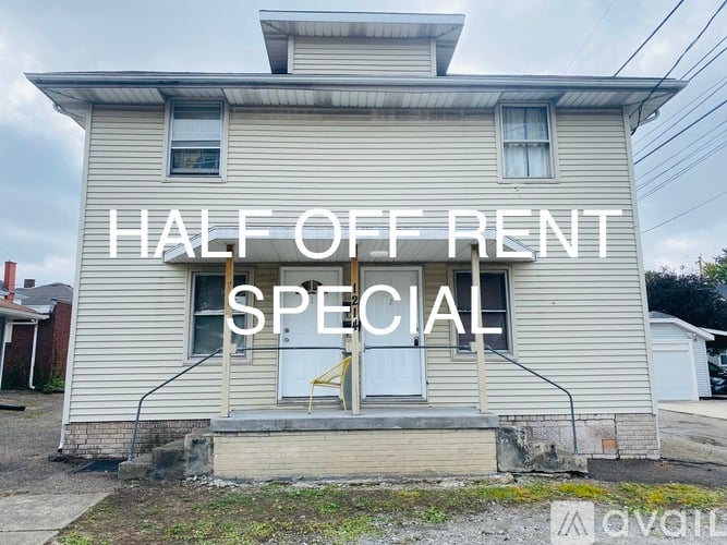 A house with a sign that says "HALF OFF RENT SPECIAL".