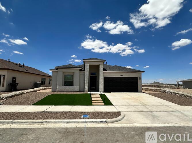 A house with a garage is available for sale.