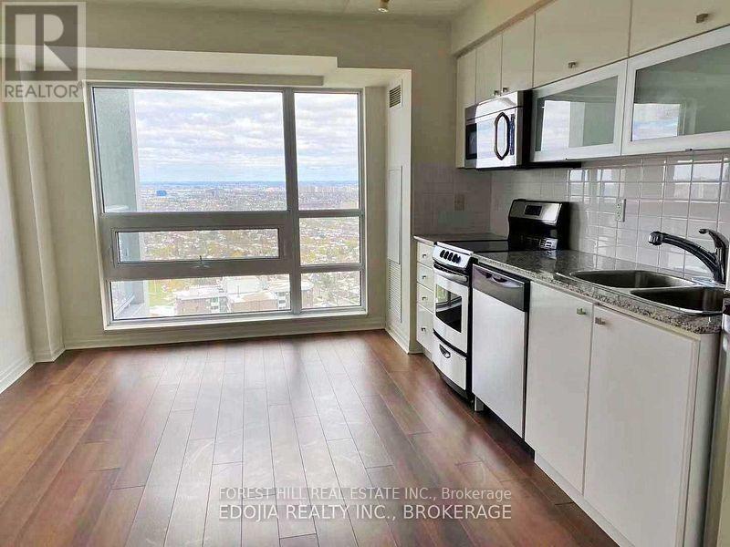 A kitchen with a view of the city.