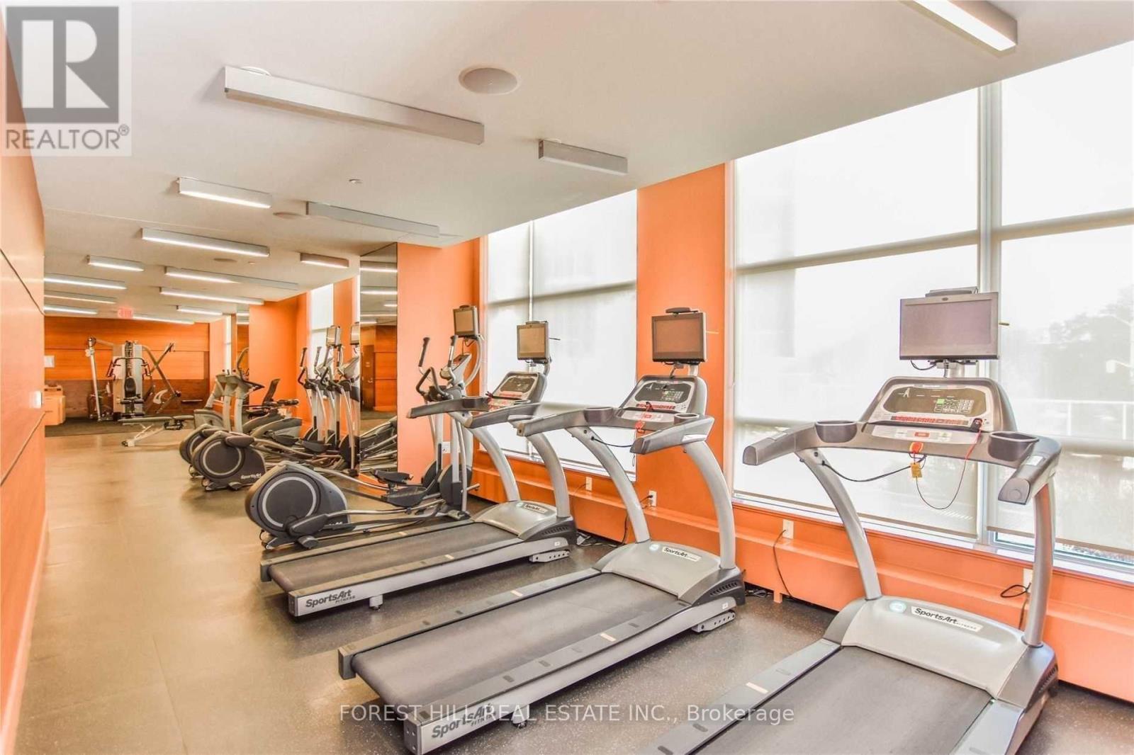 A gym with treadmills and exercise equipment.