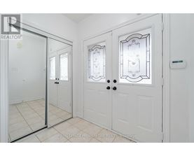 A white door with a glass panel and a handle is shown.