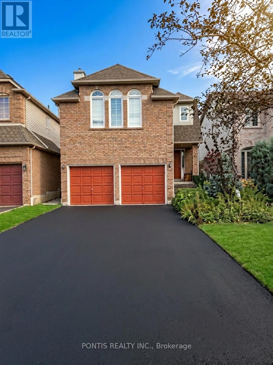 A house with a red garage door is for sale.
