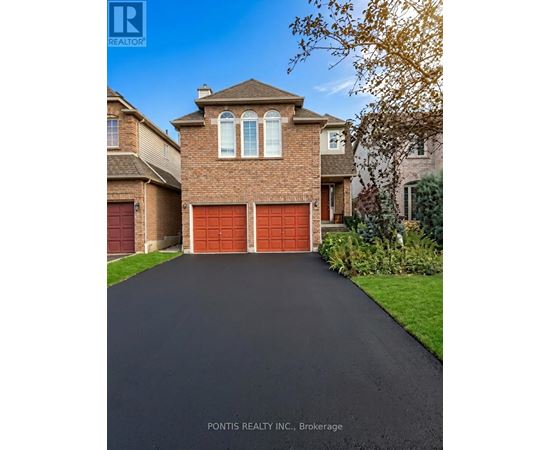 A house with a red garage door is for sale.