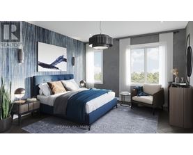 A bedroom with a large bed, a chair, and a painting on the wall.