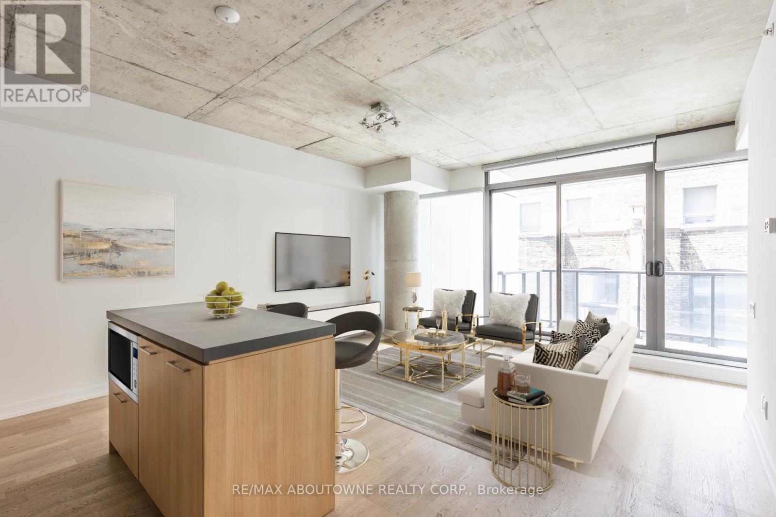 A modern living room with a wooden cabinet and a flat screen TV.
