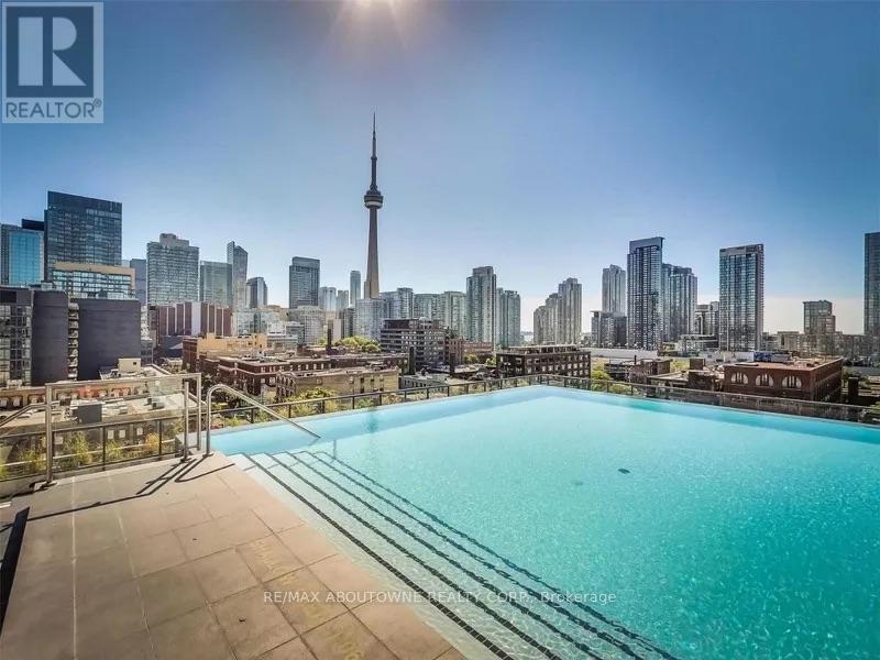 A swimming pool with a view of the city skyline.