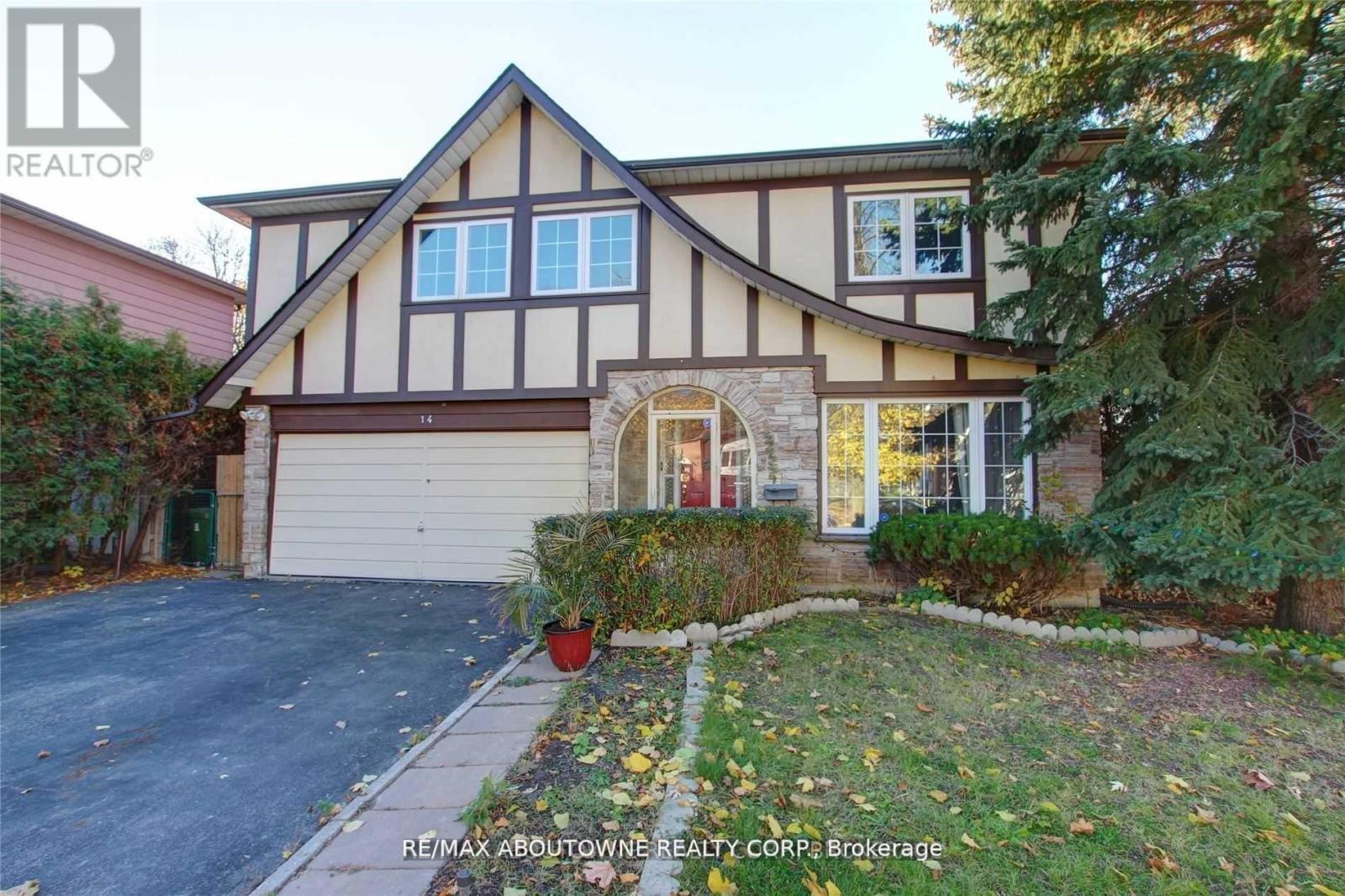 A house with a brown and white facade is for sale.