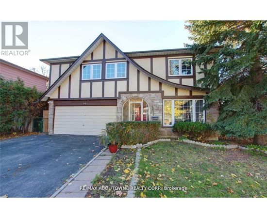 A house with a brown and white facade is for sale.