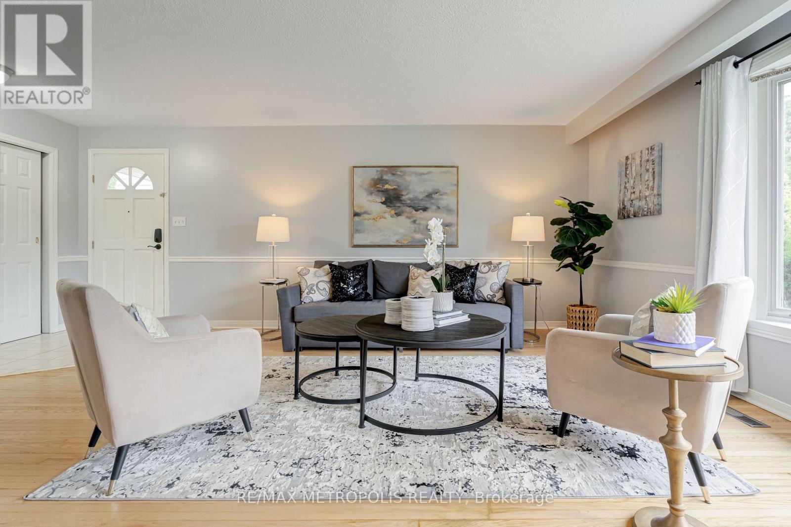 A living room with a grey sofa and a coffee table.
