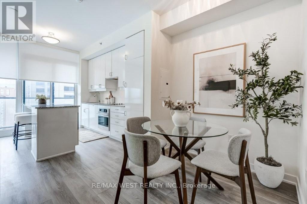 A modern kitchen with a glass table and chairs.