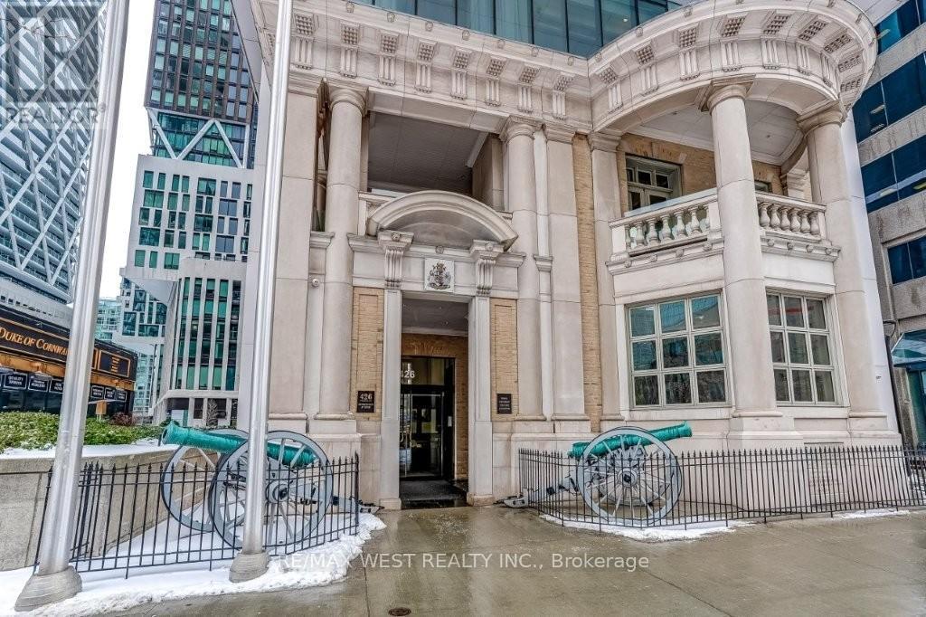 A building with a sign that says West Realty Inc. Brokerage.