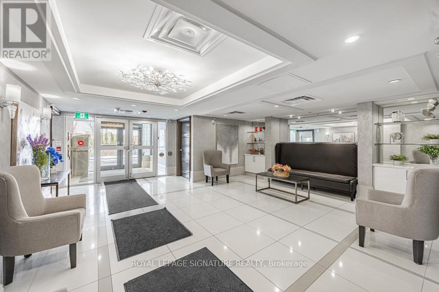 A well-lit, spacious lobby with a reception desk and seating area.