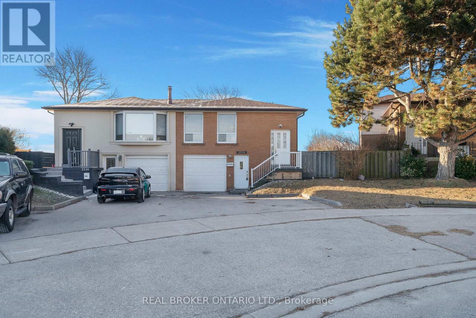 A house with a brown and beige exterior is for sale.