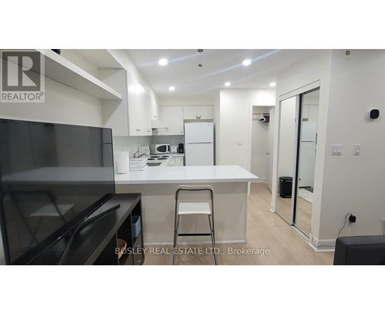 A modern kitchen with a Bosley Real Estate logo.