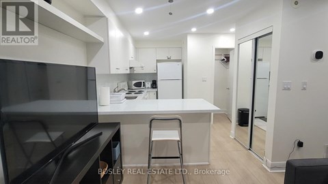 A modern kitchen with a Bosley Real Estate logo.
