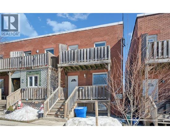 A building with a REALTOR® sign on the top left corner.