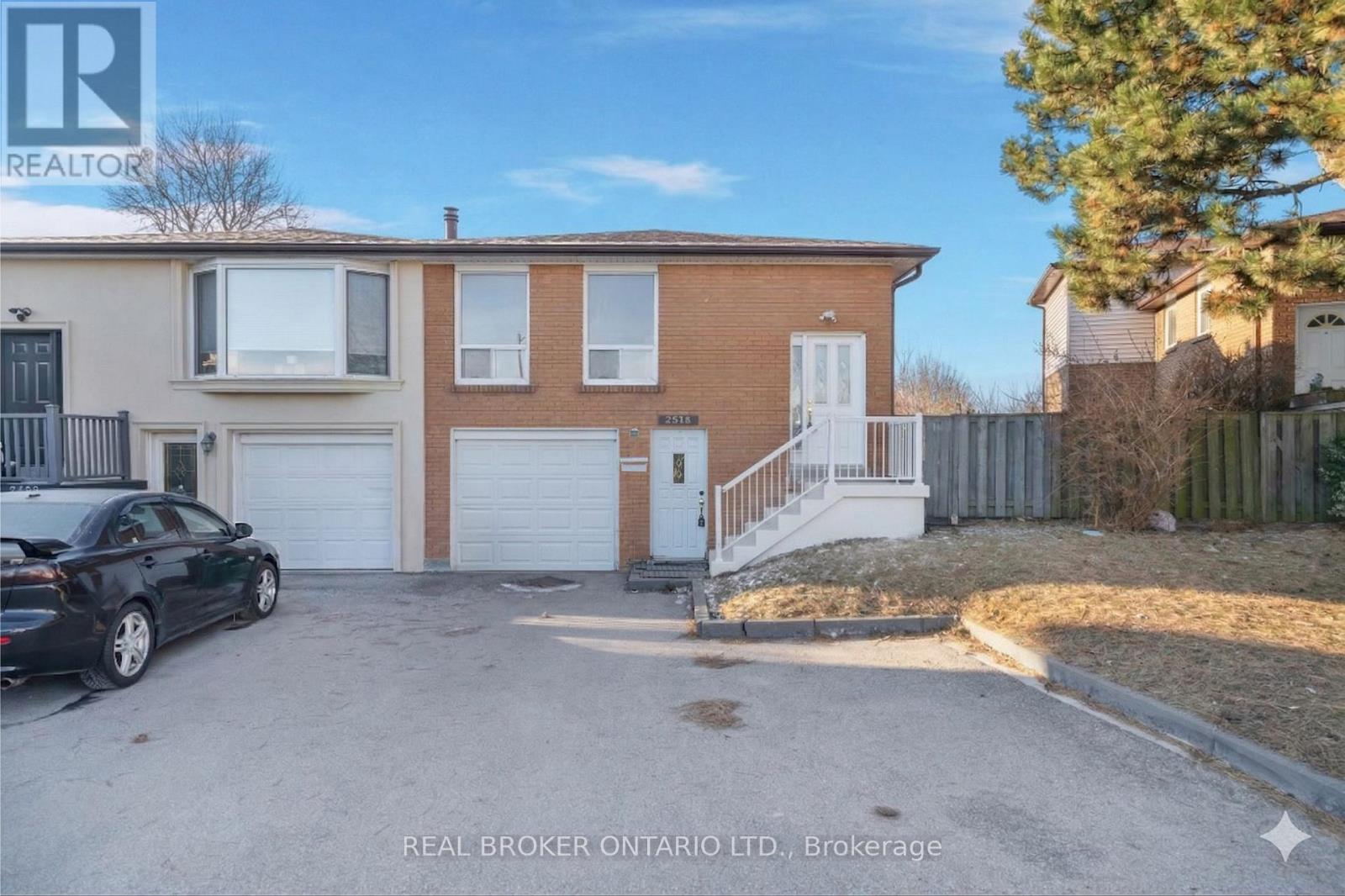 A house with a white garage door is for sale.