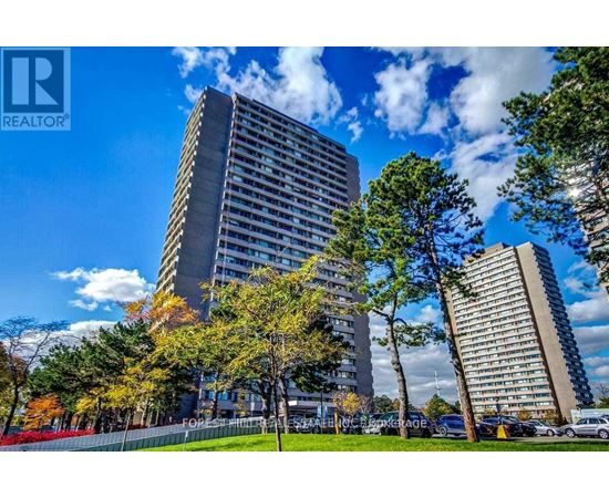 A tall building with a sign that reads REALTOR in the foreground.