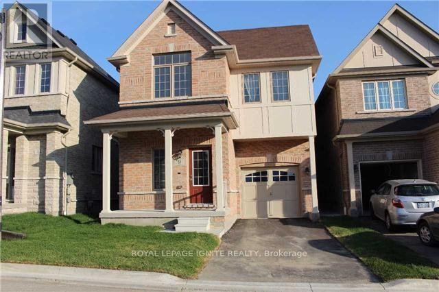 A house with a red door is for sale by Royal LePage Ignite Realty.