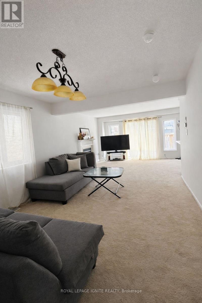 A bedroom with a bed, desk, and chair.