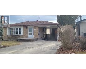 A house with a white door and a sign that says "REALTOR" on the left side.