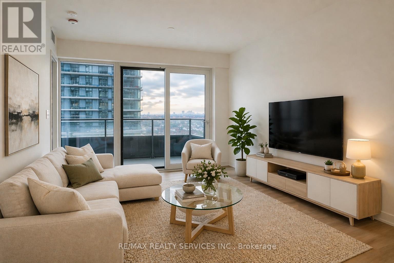 A spacious room with a view of a building outside through the glass doors.