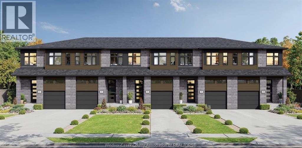 A modern house with a large front yard and two garages.