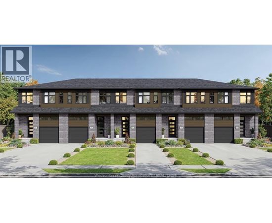 A modern house with a large front yard and two garages.
